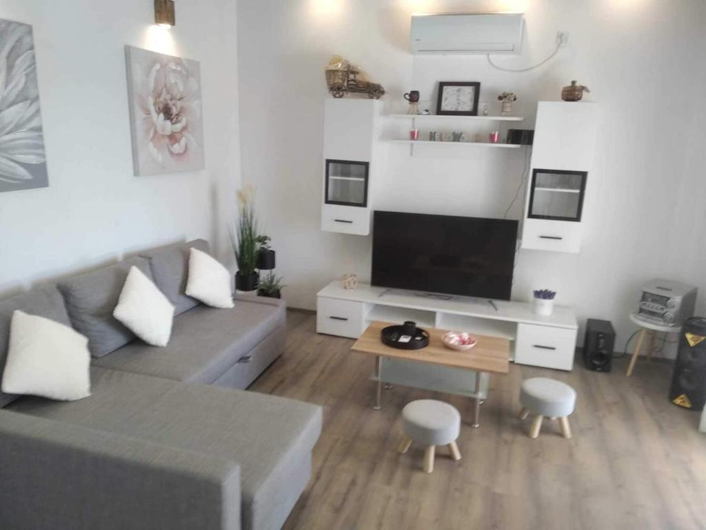 a living room with a couch and a table at Holiday Home Luca 