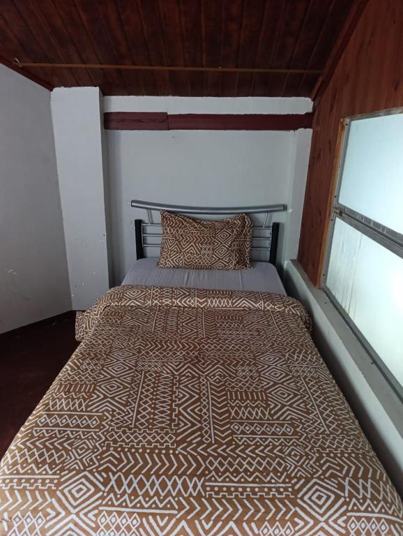 Voodi või voodid majutusasutuse Misty Mount Hostel toas