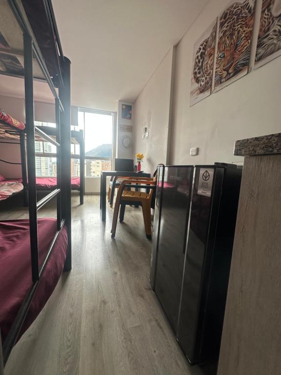 Postel nebo postele na pokoji v ubytování Davinci 1903 Bed & breakfast centro histórico Bogotá