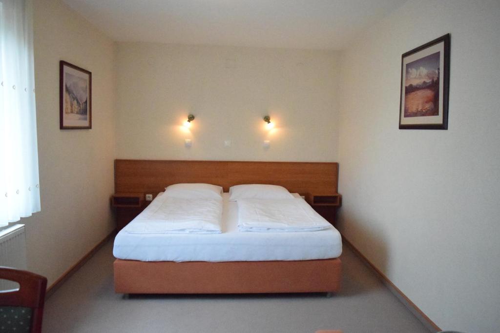Postel nebo postele na pokoji v ubytování Dežman Apartments & Rooms