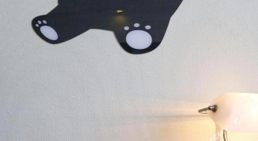 a pair of scissors hanging from a wall at Argyle International Airport Hotel Shanghai in Shanghai