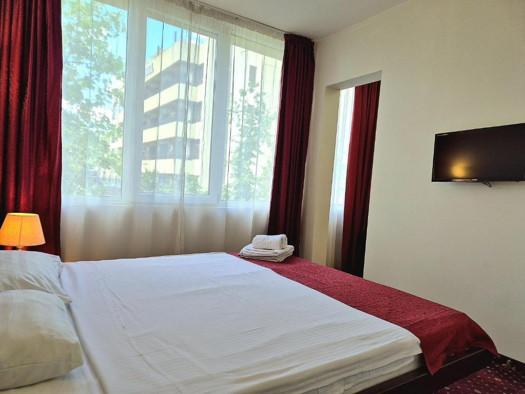 Postel nebo postele na pokoji v ubytování Hotel Marie