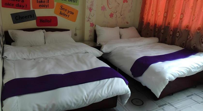 Postel nebo postele na pokoji v ubytování Halong Happy Hostel