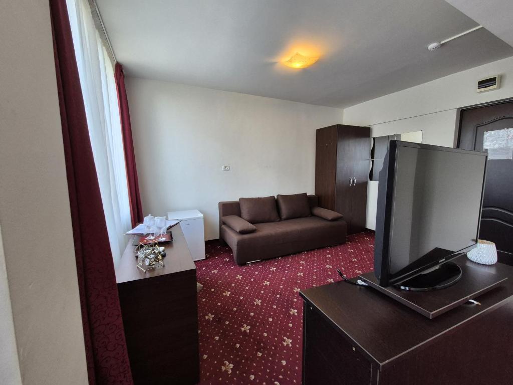 TV a/nebo společenská místnost v ubytování Hotel Marie