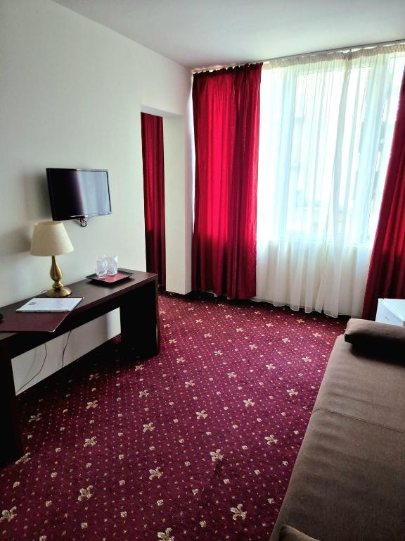 Postel nebo postele na pokoji v ubytování Hotel Marie