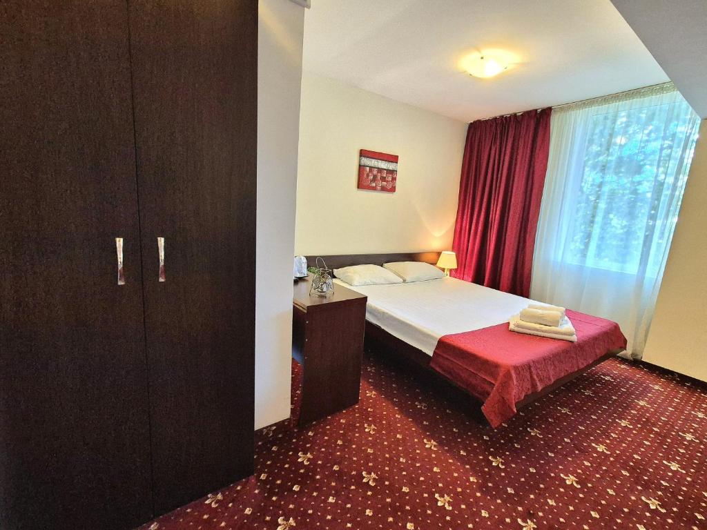 Postel nebo postele na pokoji v ubytování Hotel Marie