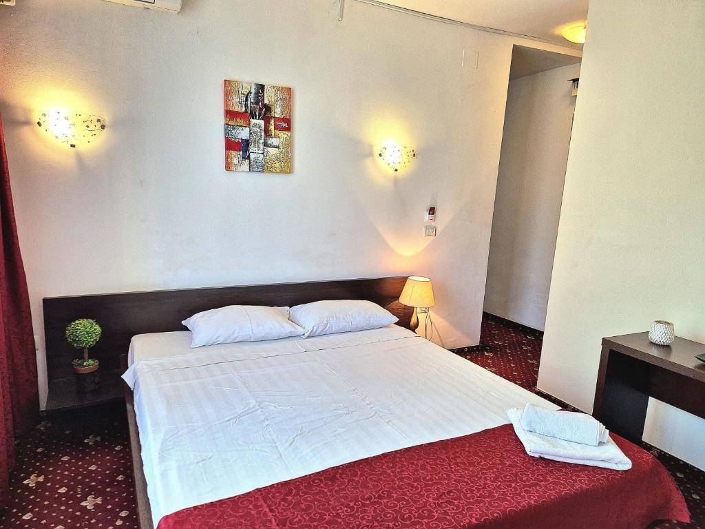 Postel nebo postele na pokoji v ubytování Hotel Marie