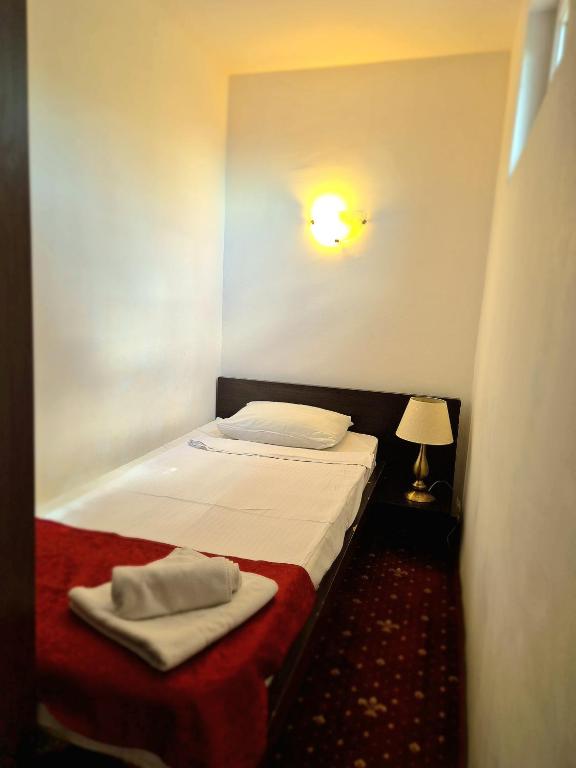 Postel nebo postele na pokoji v ubytování Hotel Marie