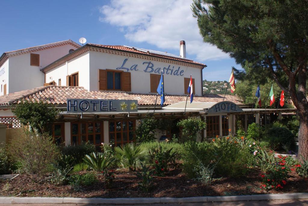 a hotel with a sign that reads la barble hotel at Hotel La Bastide in Le Lavandou