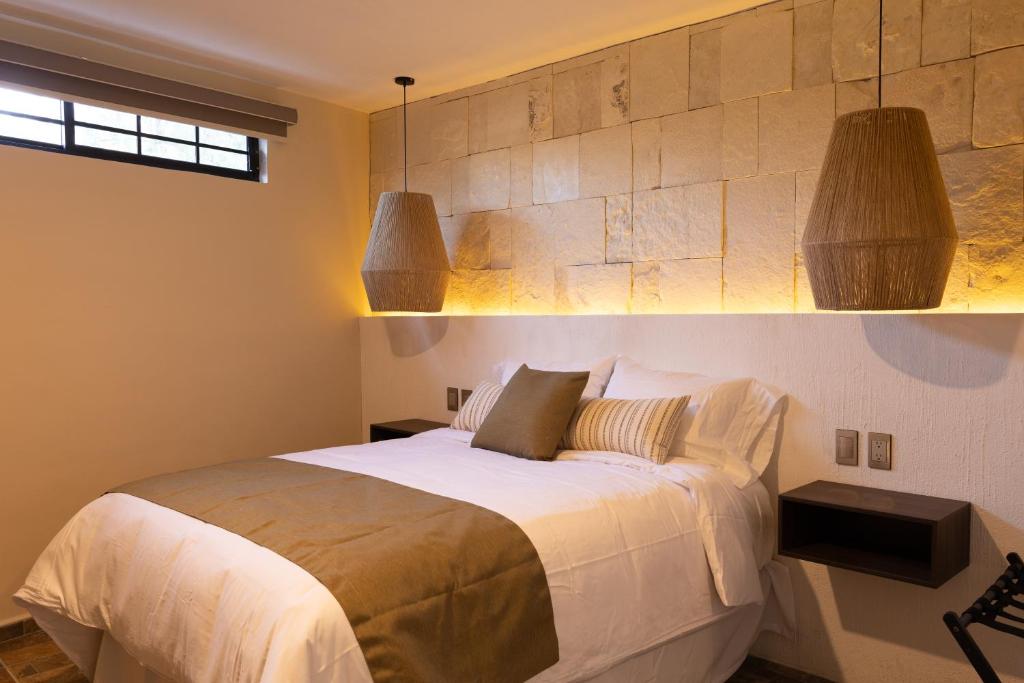 Postel nebo postele na pokoji v ubytování Traspatio Hotel Boutique