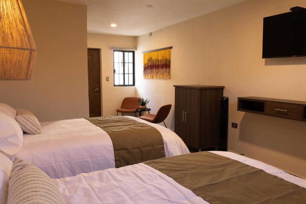 Postel nebo postele na pokoji v ubytování Traspatio Hotel Boutique