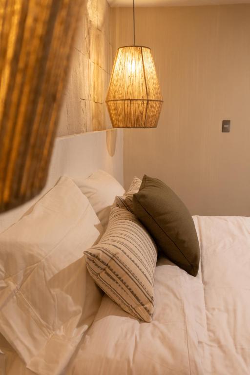 Postel nebo postele na pokoji v ubytování Traspatio Hotel Boutique