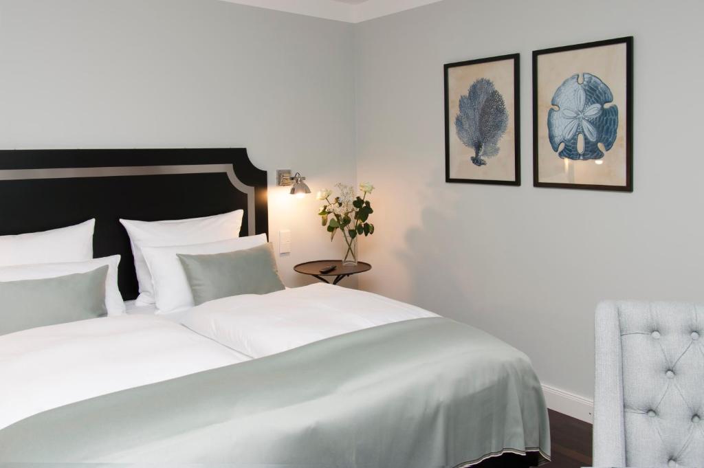 Postel nebo postele na pokoji v ubytování Hotel im Hof
