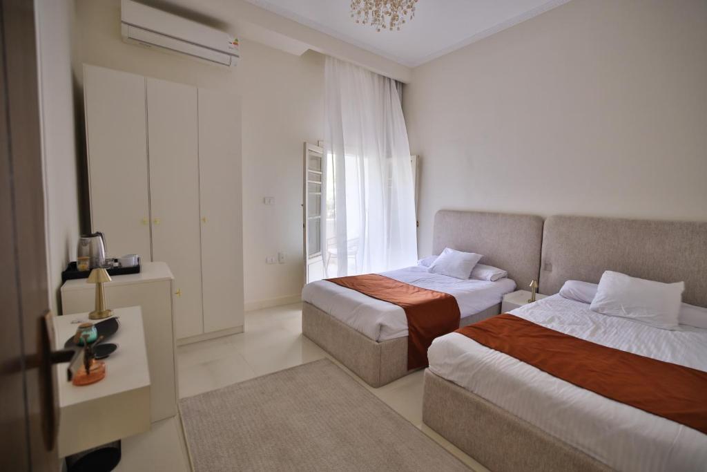 Postel nebo postele na pokoji v ubytování Sphinx House