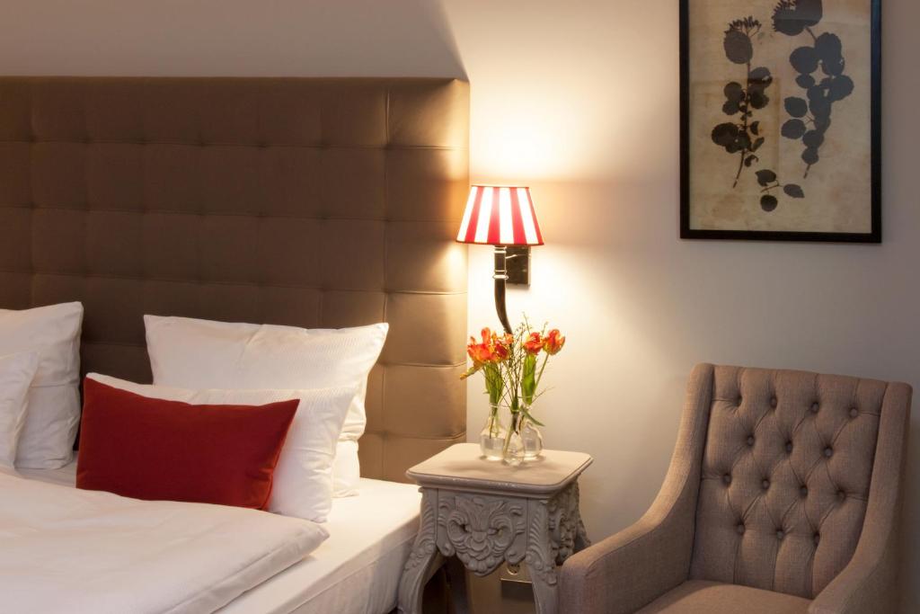 Postel nebo postele na pokoji v ubytování Hotel im Hof
