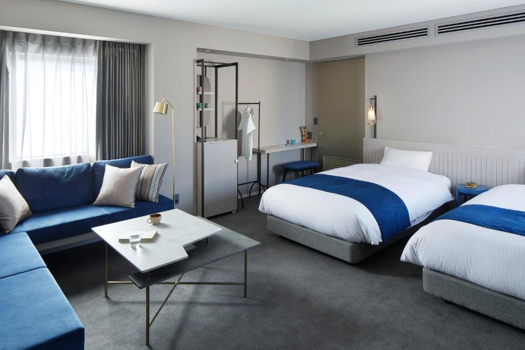 Postel nebo postele na pokoji v ubytování HOTEL TORIFITO KANAZAWA
