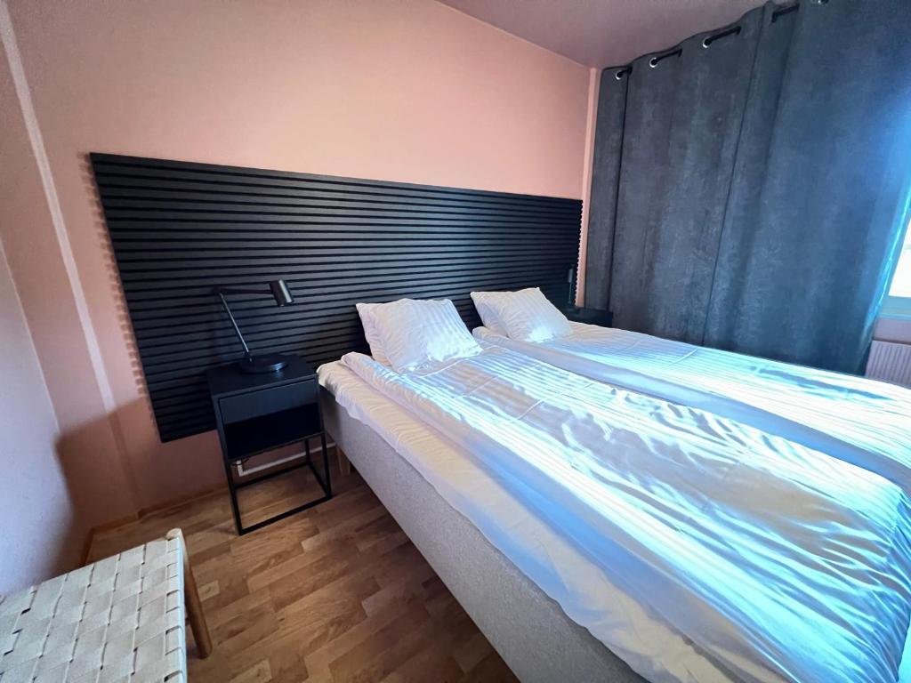 Postel nebo postele na pokoji v ubytování Hotell Linnéa