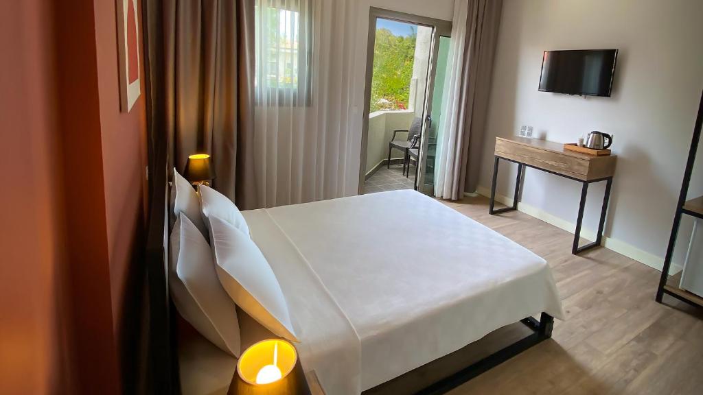 Postel nebo postele na pokoji v ubytování Sahil Butik Otel