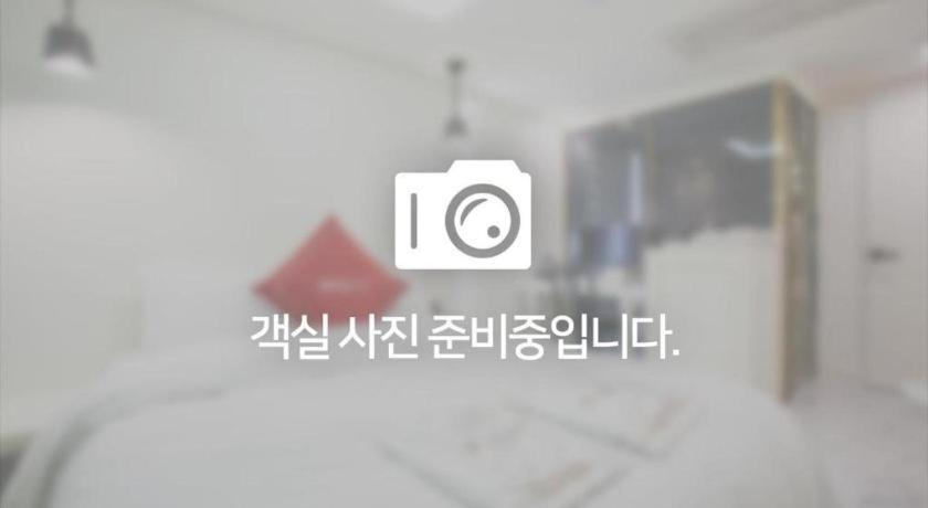 Postel nebo postele na pokoji v ubytování Yongin Valentine