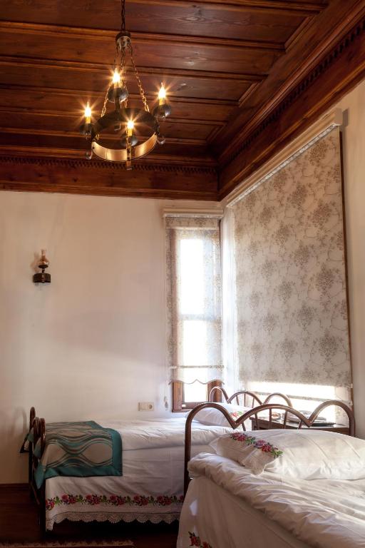 Postel nebo postele na pokoji v ubytování Lal Hotel Bursa
