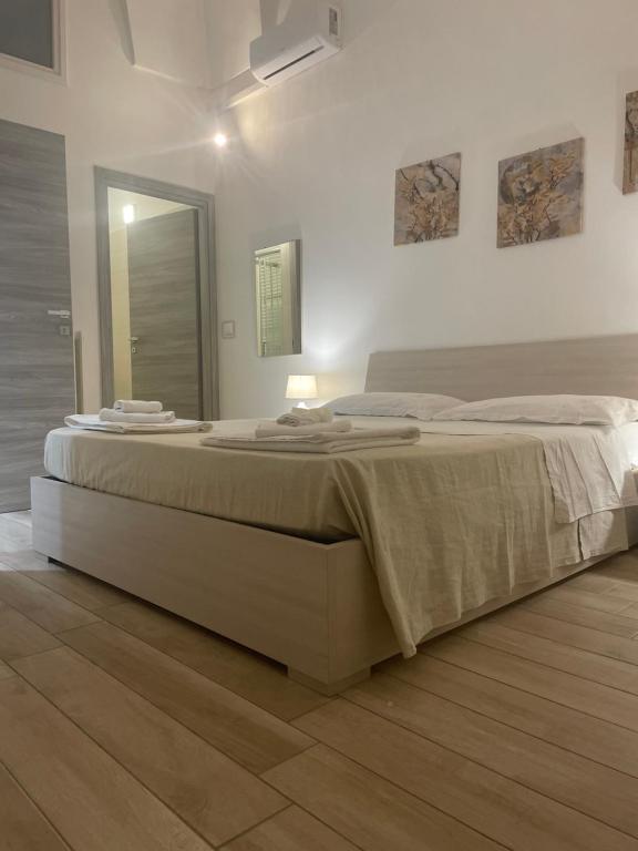 Posteľ alebo postele v izbe v ubytovaní O' sole mio Rudiae Rooms