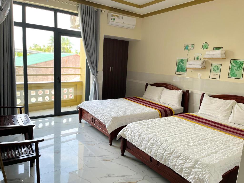 Giường trong phòng chung tại T'H Homestay