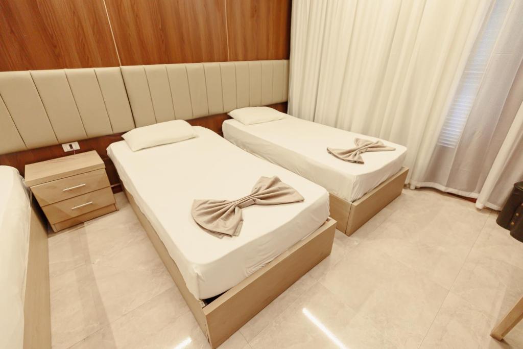 Postel nebo postele na pokoji v ubytování City Hotel