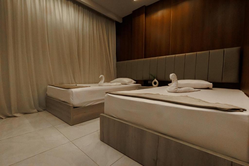Postel nebo postele na pokoji v ubytování City Hotel