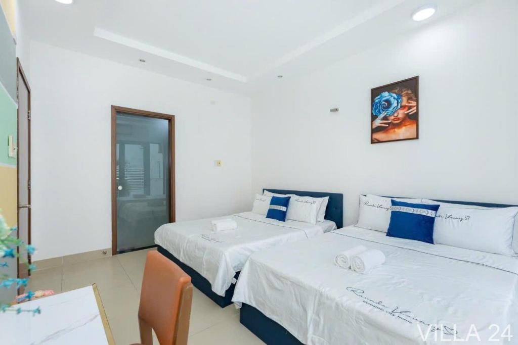 Postel nebo postele na pokoji v ubytování Villages Bãi Sau Vũng Tàu OCEAN 24 Gần Biển