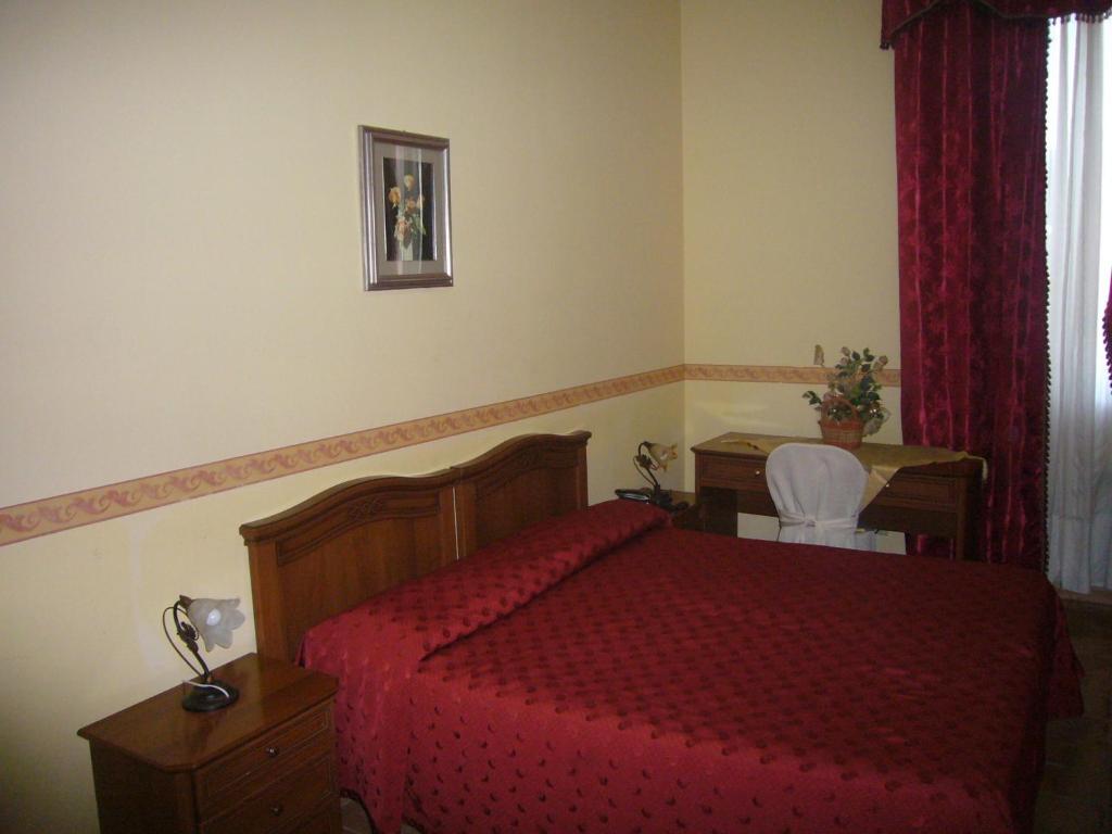 Postel nebo postele na pokoji v ubytování Villa Altieri