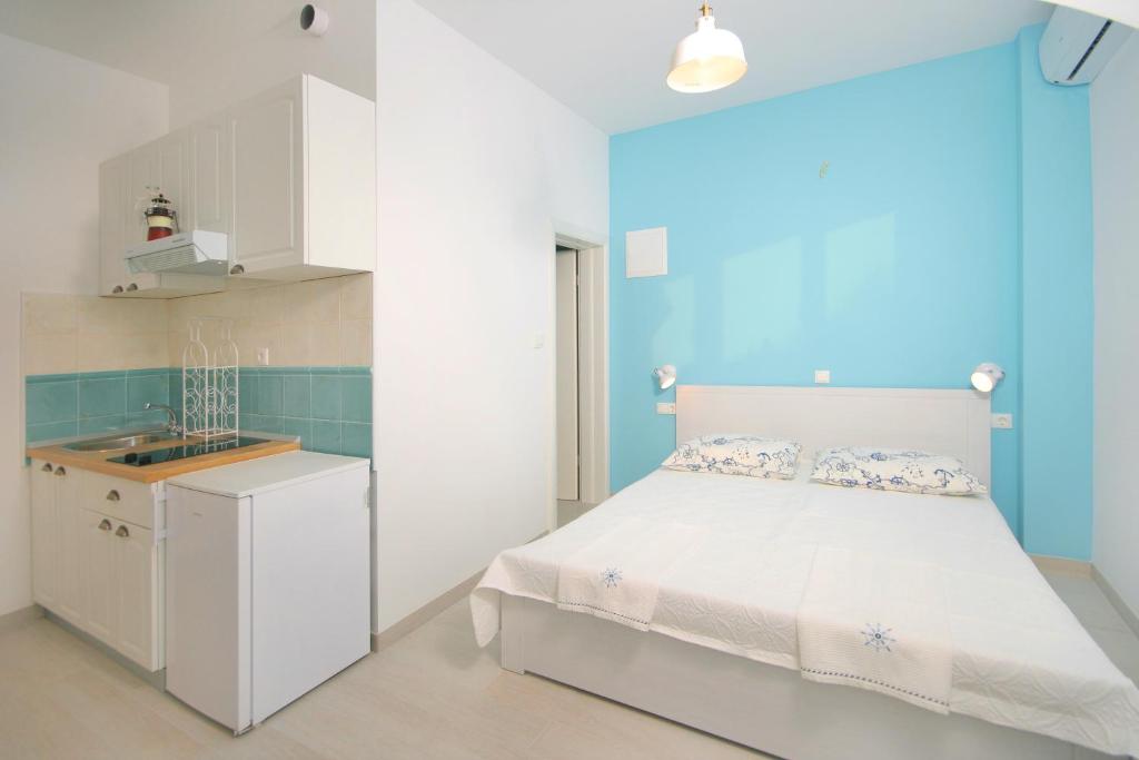 Postel nebo postele na pokoji v ubytování Apartments Parcela