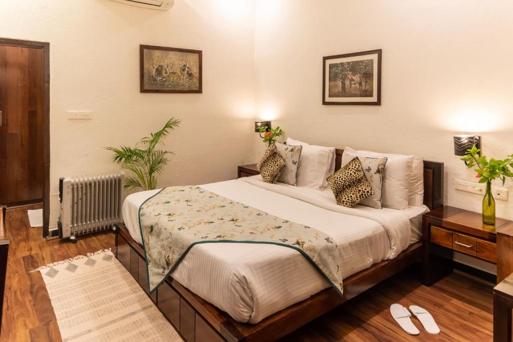 Postel nebo postele na pokoji v ubytování Ranthambhore Aangan