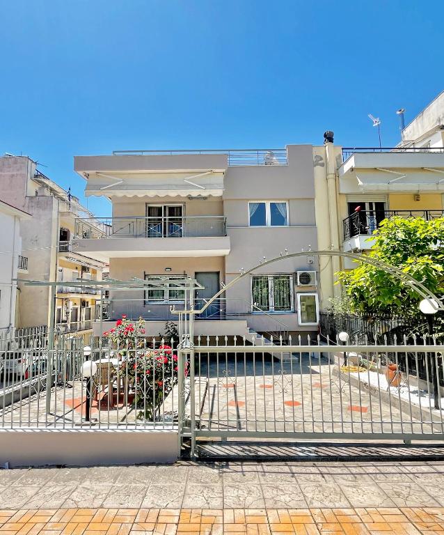 a building with a gate in front of it at Thess City House with Parking in Thessaloniki