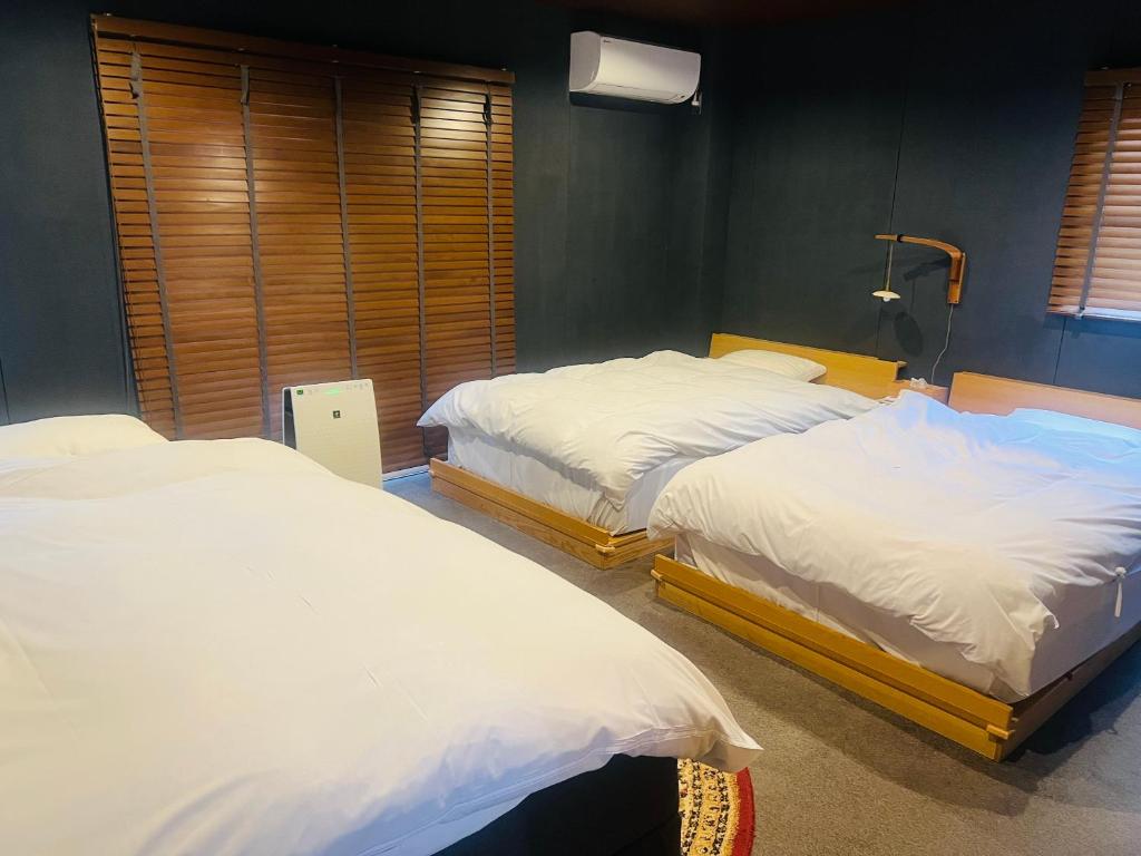 Postel nebo postele na pokoji v ubytování SIMA inn