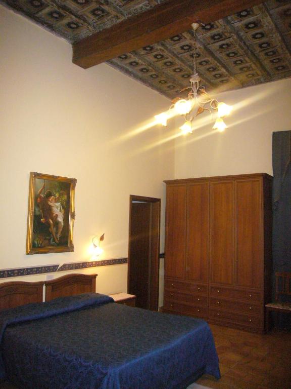 Postel nebo postele na pokoji v ubytování Villa Altieri