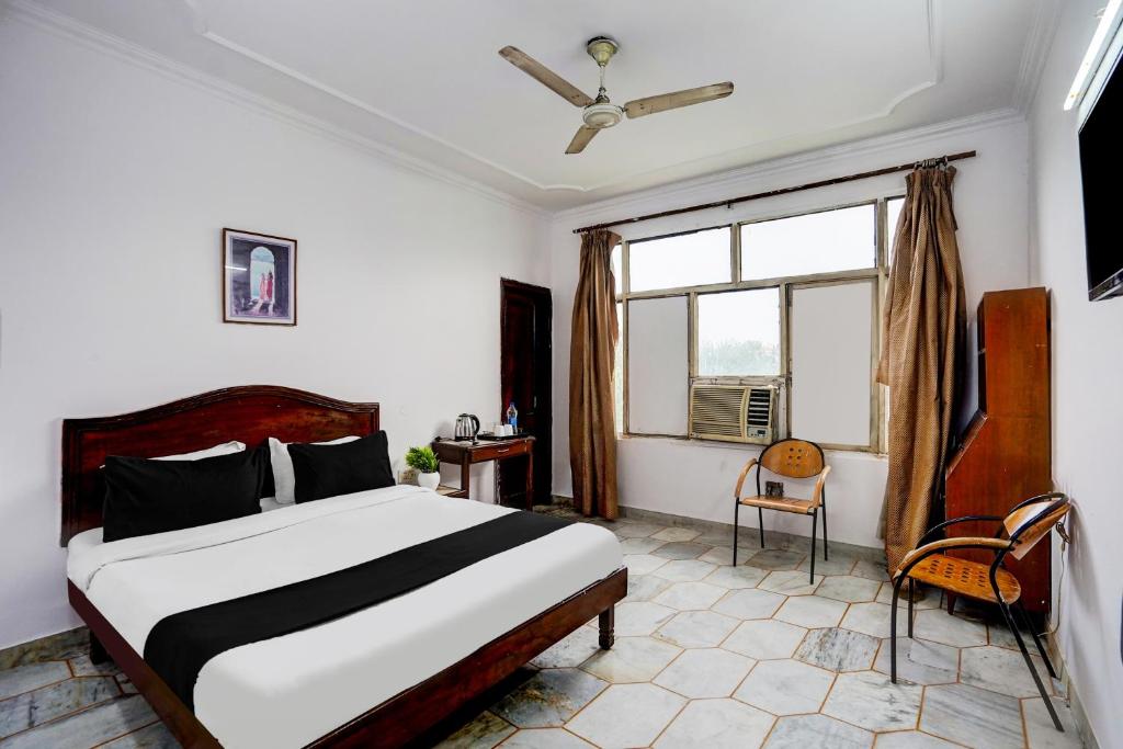 Postel nebo postele na pokoji v ubytování Hotel O Iconic Residency