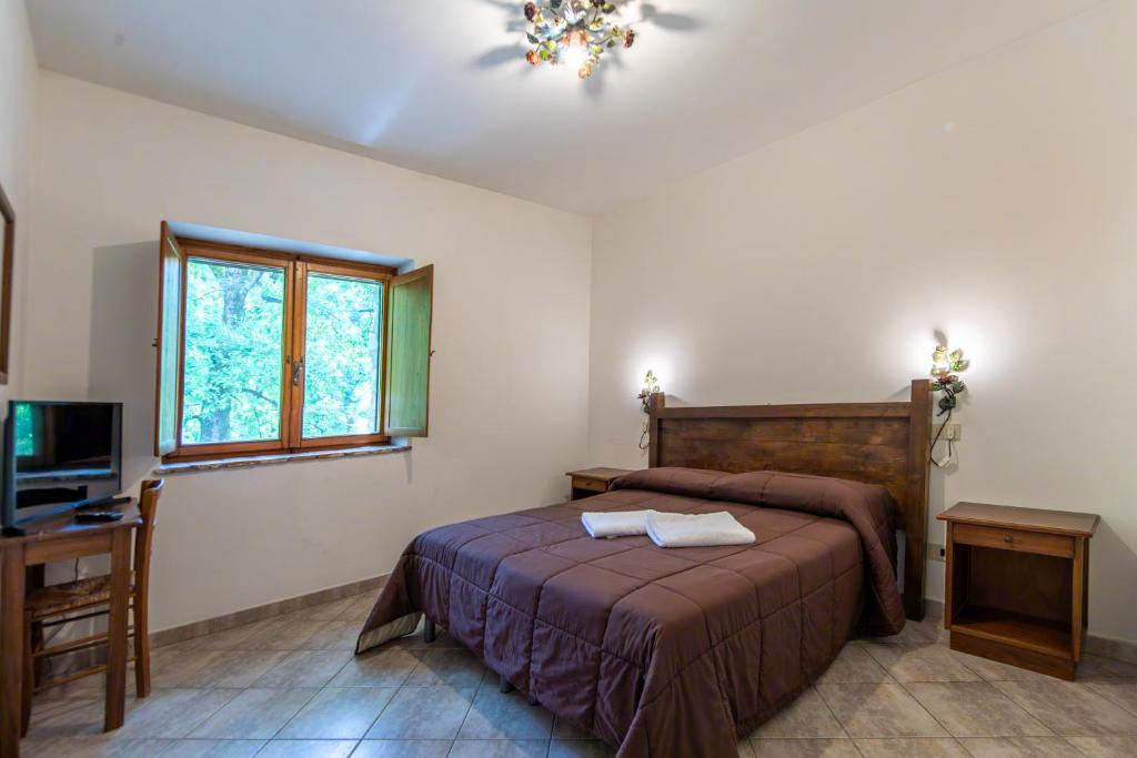 Postel nebo postele na pokoji v ubytování Agriturismo La Ferrera