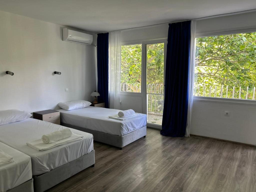 Ένα ή περισσότερα κρεβάτια σε δωμάτιο στο Морска База Даскалов # Daskalov Seaside Holiday Home