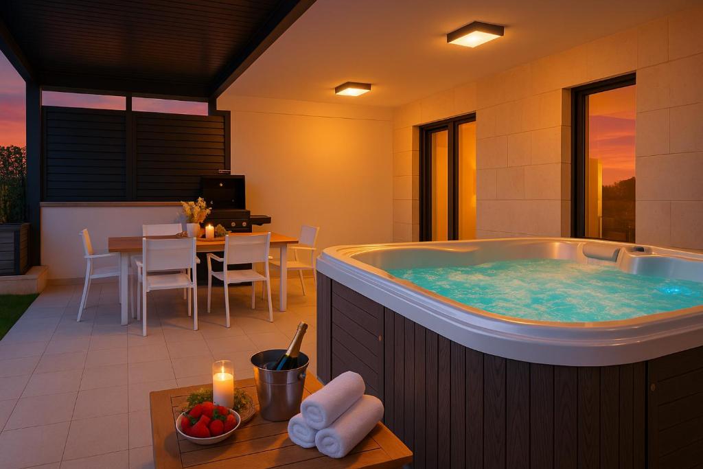 a jacuzzi tub in the middle of a room at Luxury Apartment Mona with Garden & Jacuzzi in Zadar, Borik in Zadar