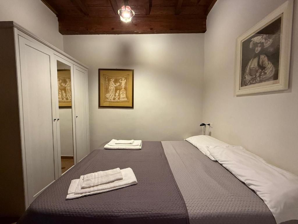 Postel nebo postele na pokoji v ubytování BIANCOFIORE Alloggio Turistico