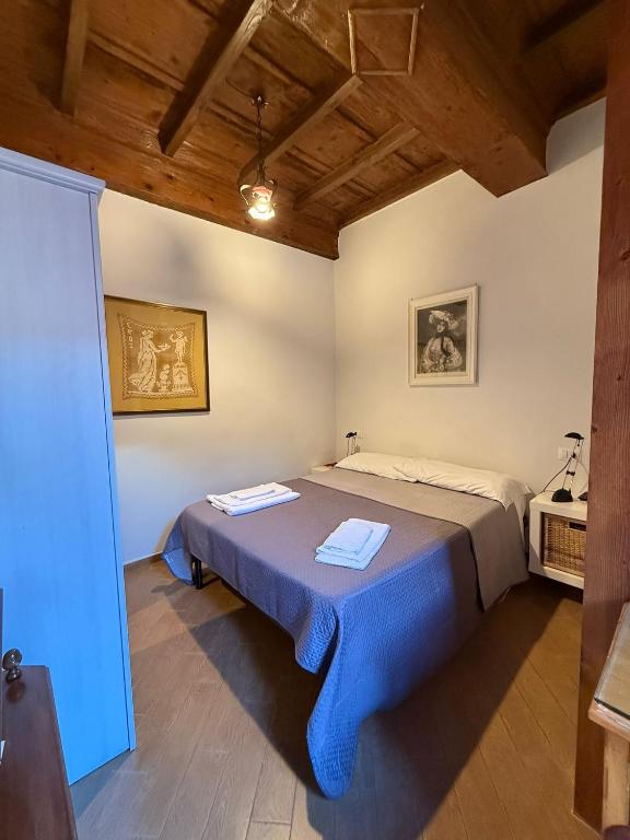 Postel nebo postele na pokoji v ubytování BIANCOFIORE Alloggio Turistico