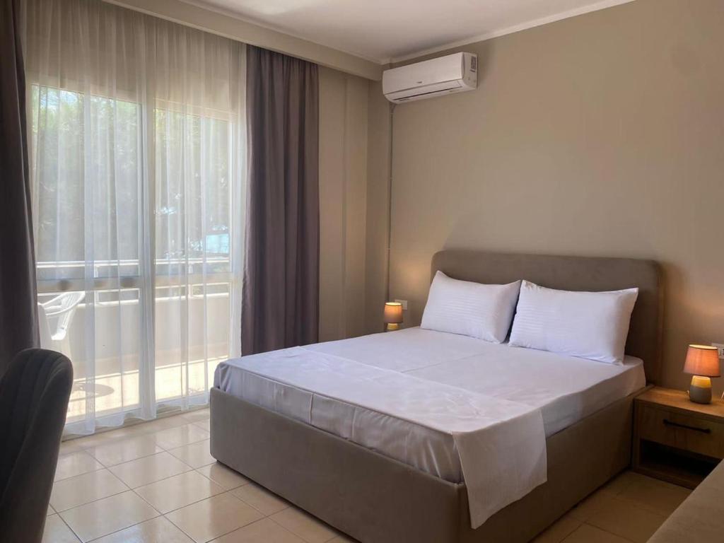 Postel nebo postele na pokoji v ubytování Rumar Hotel