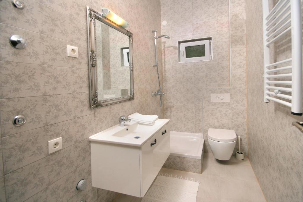 Koupelna v ubytování Apartments Parcela