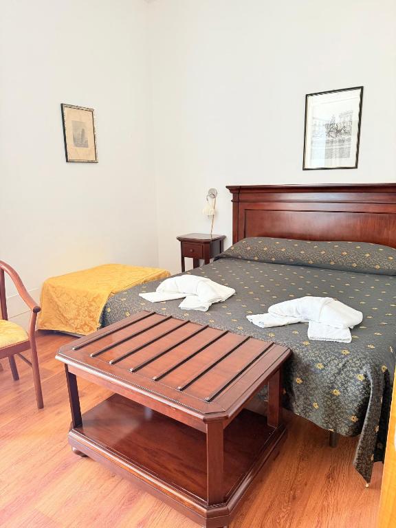 Voodi või voodid majutusasutuse Hotel Archimede Ortigia toas
