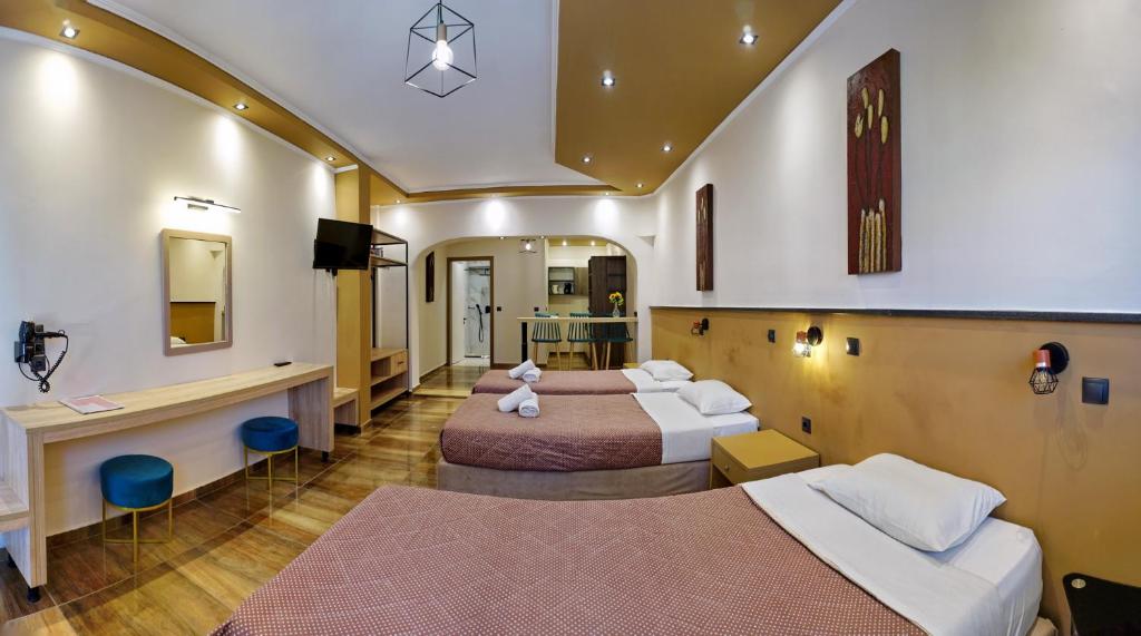 Postel nebo postele na pokoji v ubytování Hotel Marilena