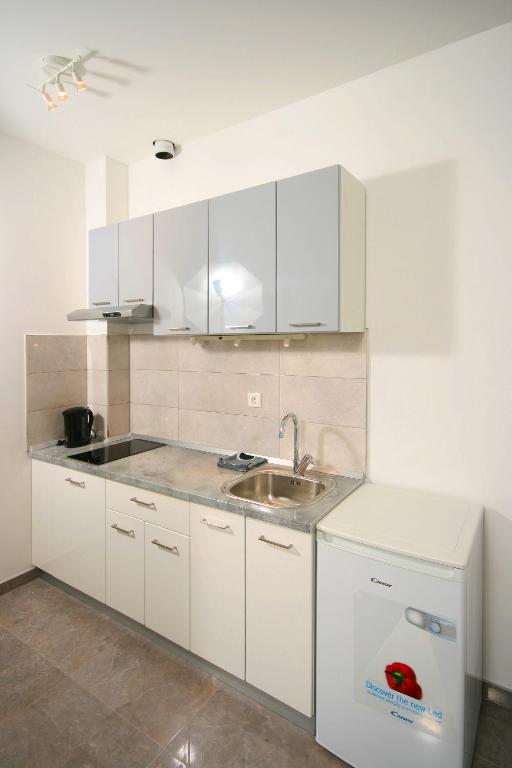 Kuchyň nebo kuchyňský kout v ubytování Apartments Parcela