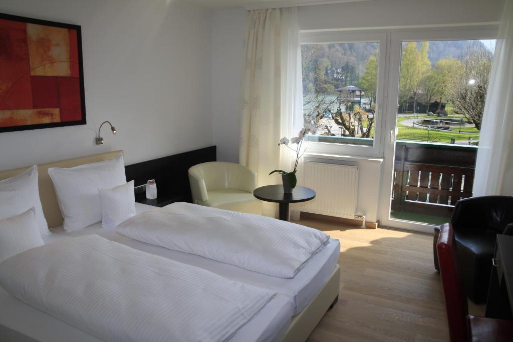 Postel nebo postele na pokoji v ubytování Seehotel Lilly