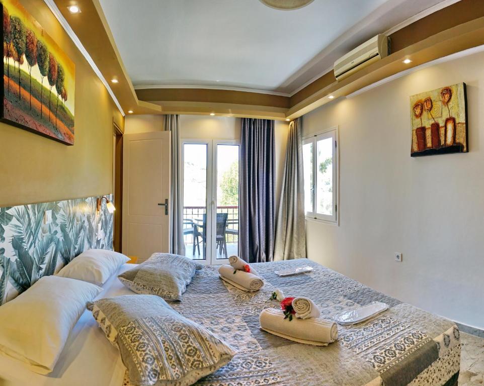 Postel nebo postele na pokoji v ubytování Hotel Marilena