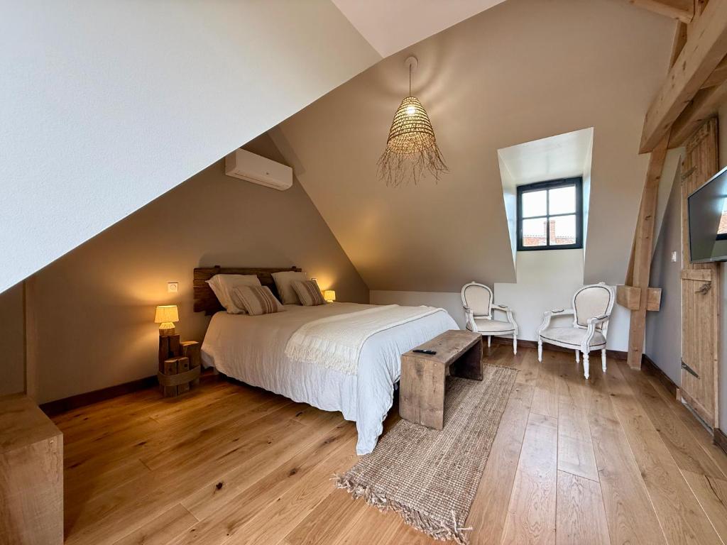 Postel nebo postele na pokoji v ubytování Au Détour des Châteaux