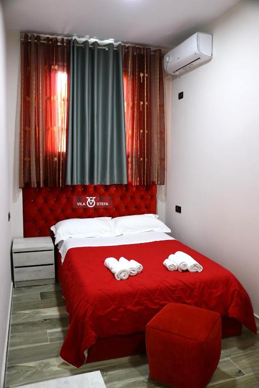 Postel nebo postele na pokoji v ubytování Hotel Vila Stefa